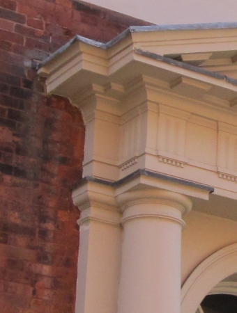 Close-up of the Doric capital and entablature.
